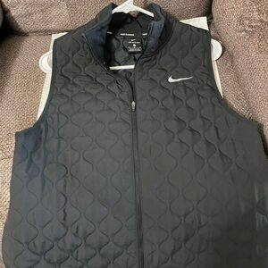 Nike Aerolayer Black quilted vest. It is unisex. No tags, but never worn